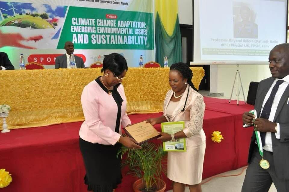 Presentation of an award plaque at the 2019 SETPOM conference