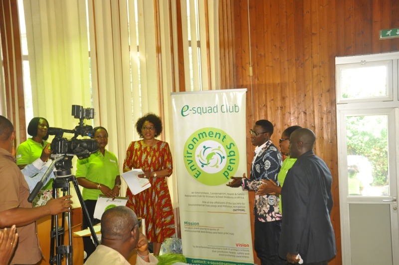 Guests standing beside the Environment Squad Club banner